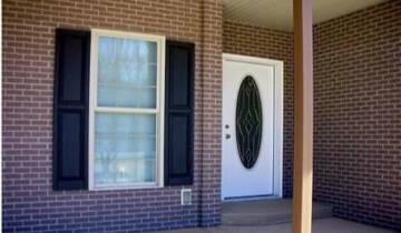 A house porch with brick veneers installed