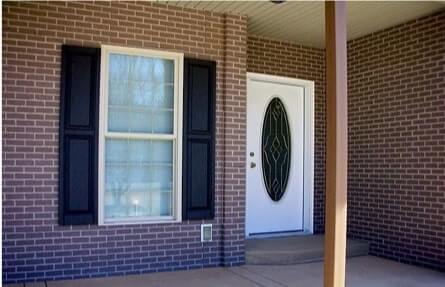 A house porch with brick veneers installed