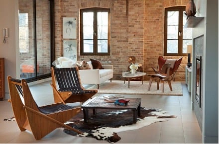 Brick wall used in large, open rooms to add texture to the space.