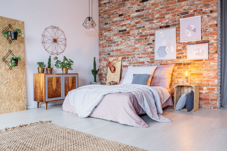 Exposed Interior Brick in Bright Bedroom