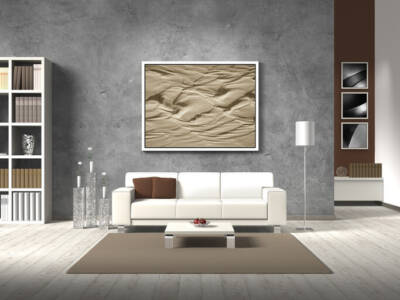 A modern living room with a concrete accent wall.