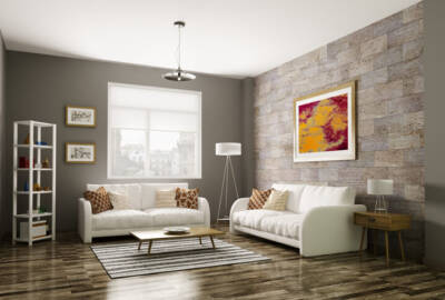 A grey living room with a stone accent wall
